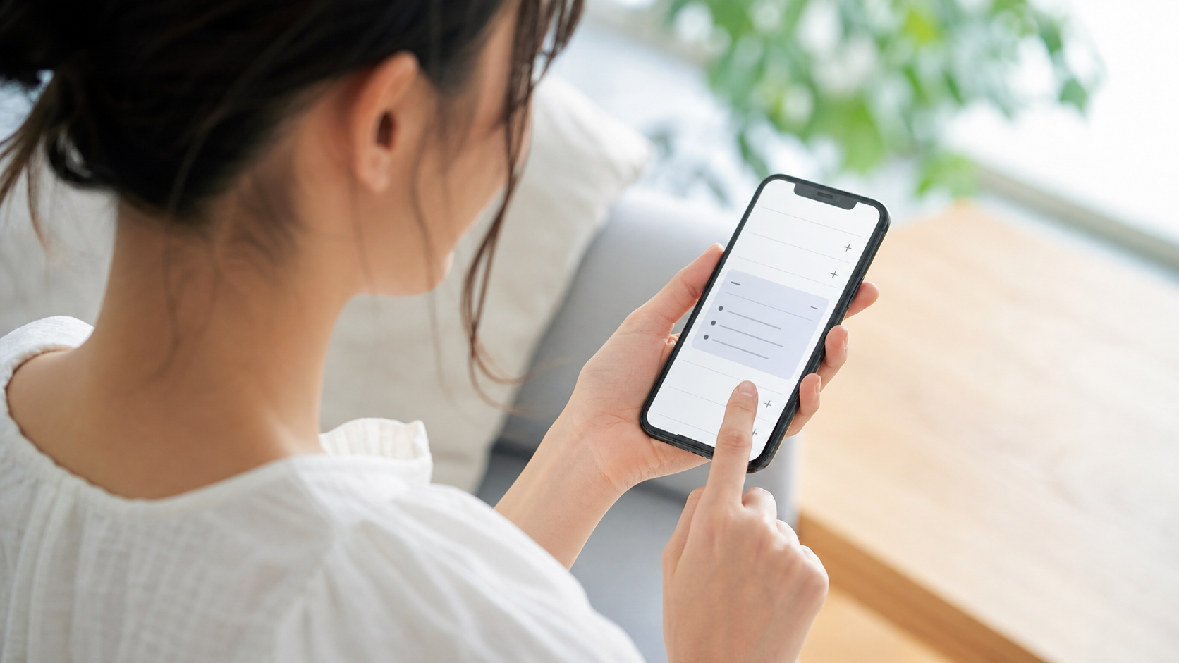 スマートフォンで必要な質問だけを開いて読む利用者